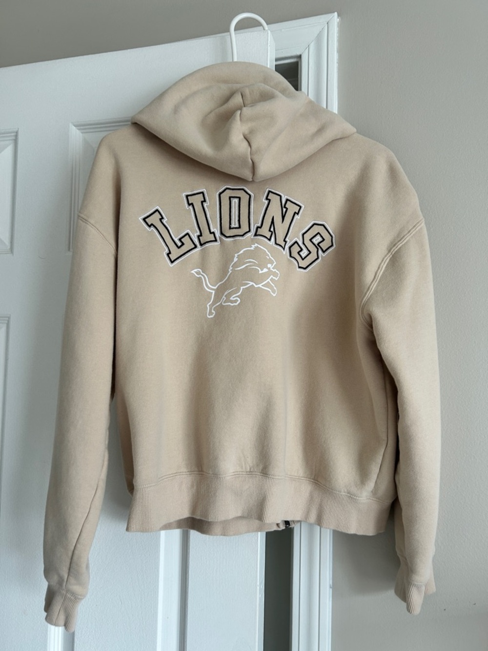 Buttercream colored Detroit Lions full zip crop hoodie by WEAR by Erin Andrews